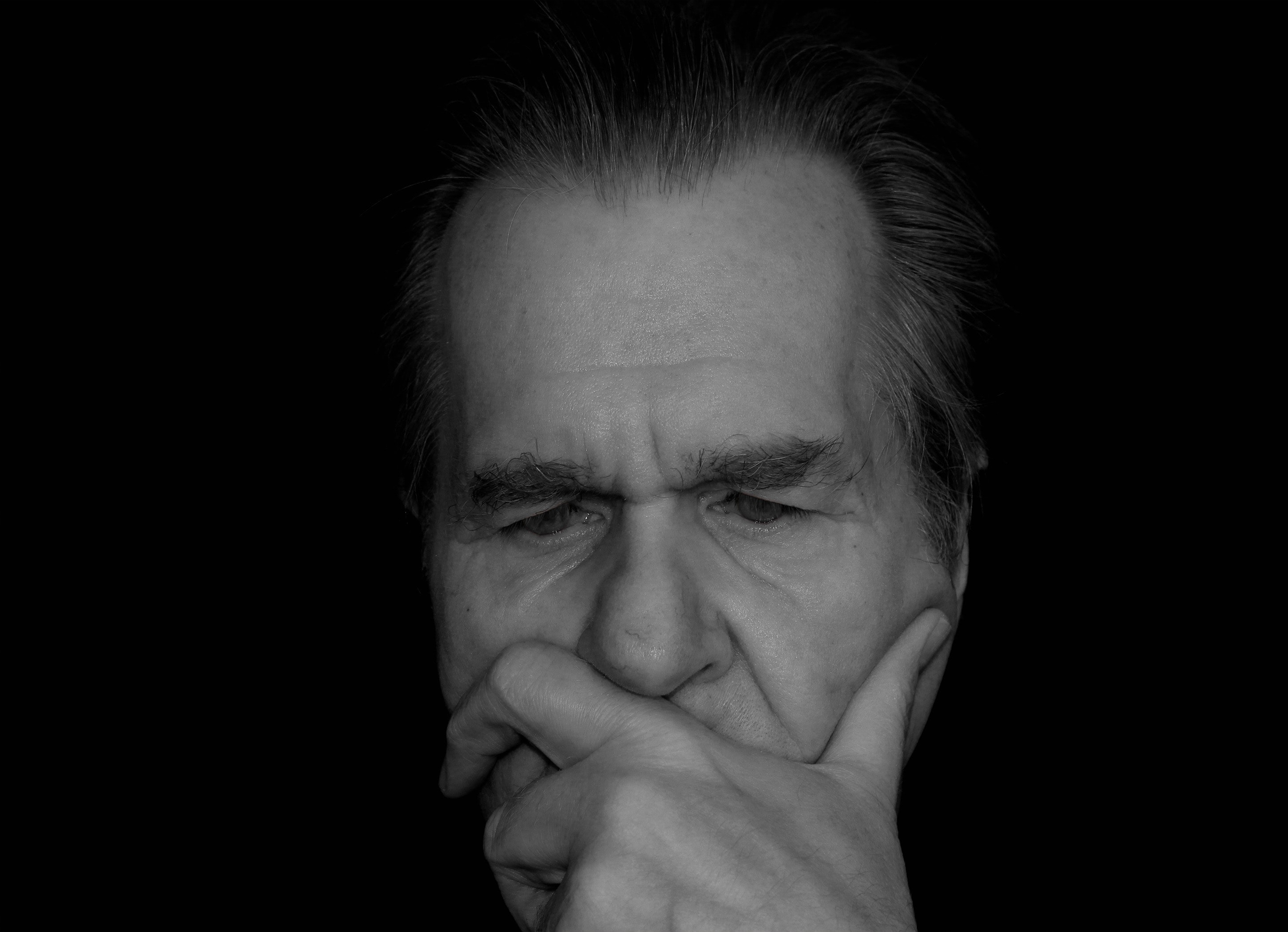 elderly man thinking about Cognitive Behavioral Therapy